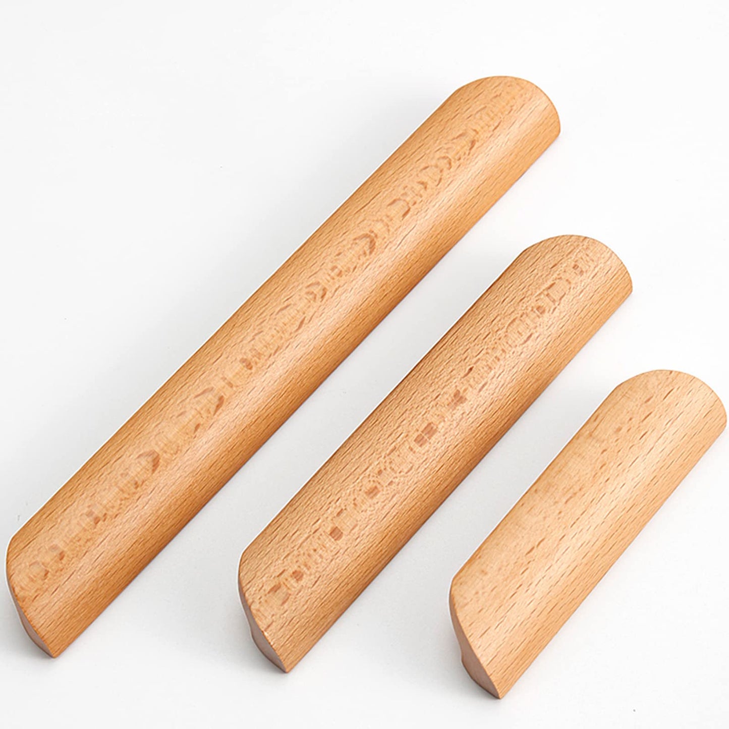 Wood half-round cabinet finger pull in beech with 192 mm centers, arranged with other sizes and finishes for comparison
