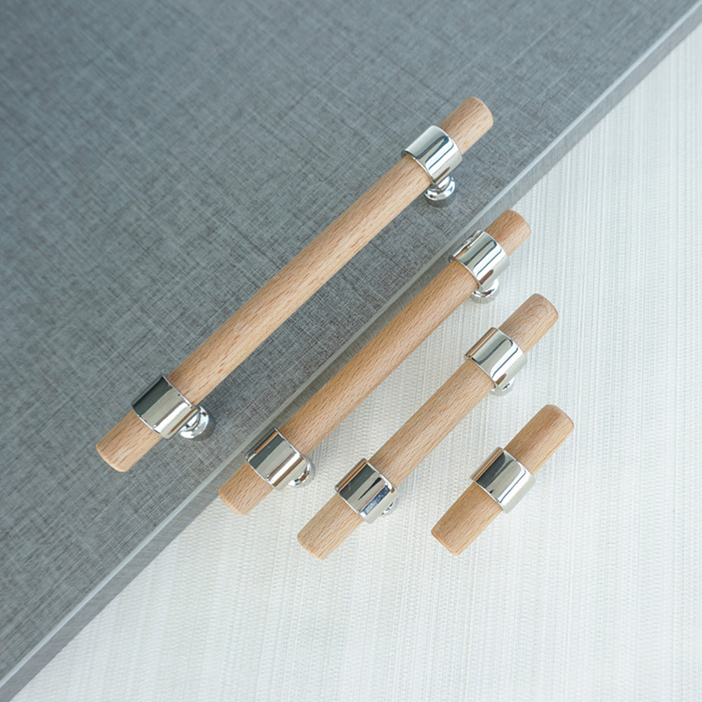 Wood cabinet pull with metal posts in light wood with silver posts, shown as a mixed lineup of related hardware pieces