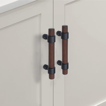Wood cabinet pull with metal posts, mounted as matching hardware on double cabinet doors