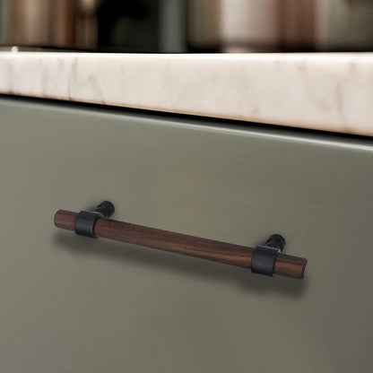 Wood cabinet pull with metal posts, installed on light cabinet doors with the profile visible