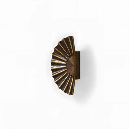 Sunburst half-moon cabinet pull and round knob, pictured in one view on a clean neutral background