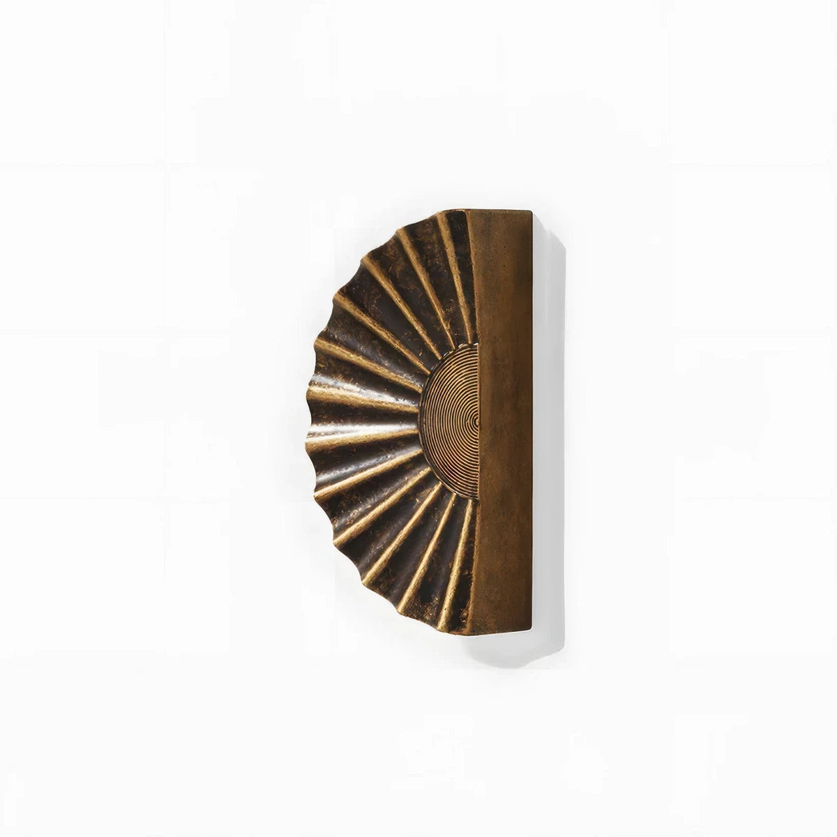 Sunburst half-moon cabinet pull and round knob, presented for reference on a clean neutral background