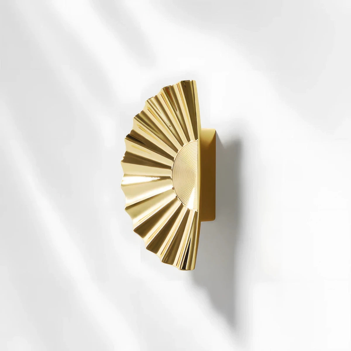 Sunburst half-moon cabinet pull and round knob, shown in a focused view on a clean neutral background