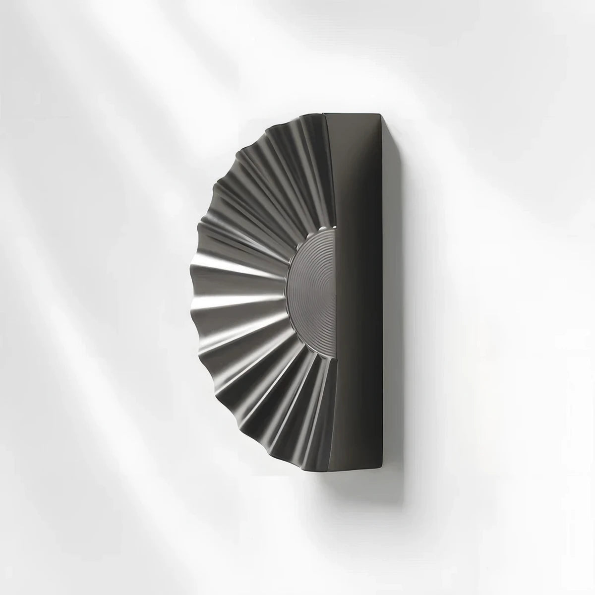 Sunburst half-moon cabinet pull and round knob, presented in another view with its shape and finish visible