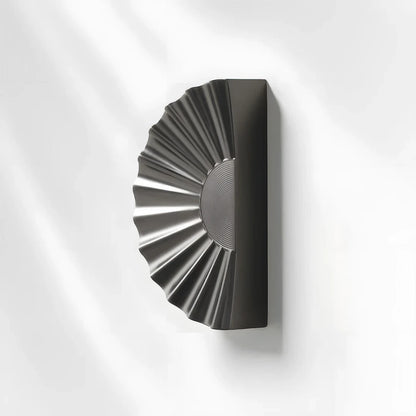Sunburst half-moon cabinet pull and round knob, presented in another view with its shape and finish visible