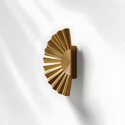 Sunburst half-moon cabinet pull and round knob, shown from one angle with the profile and mounts in view