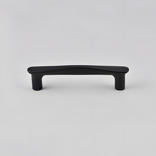 Black tapered arched brass cabinet pull, shown at close range on a clean neutral background