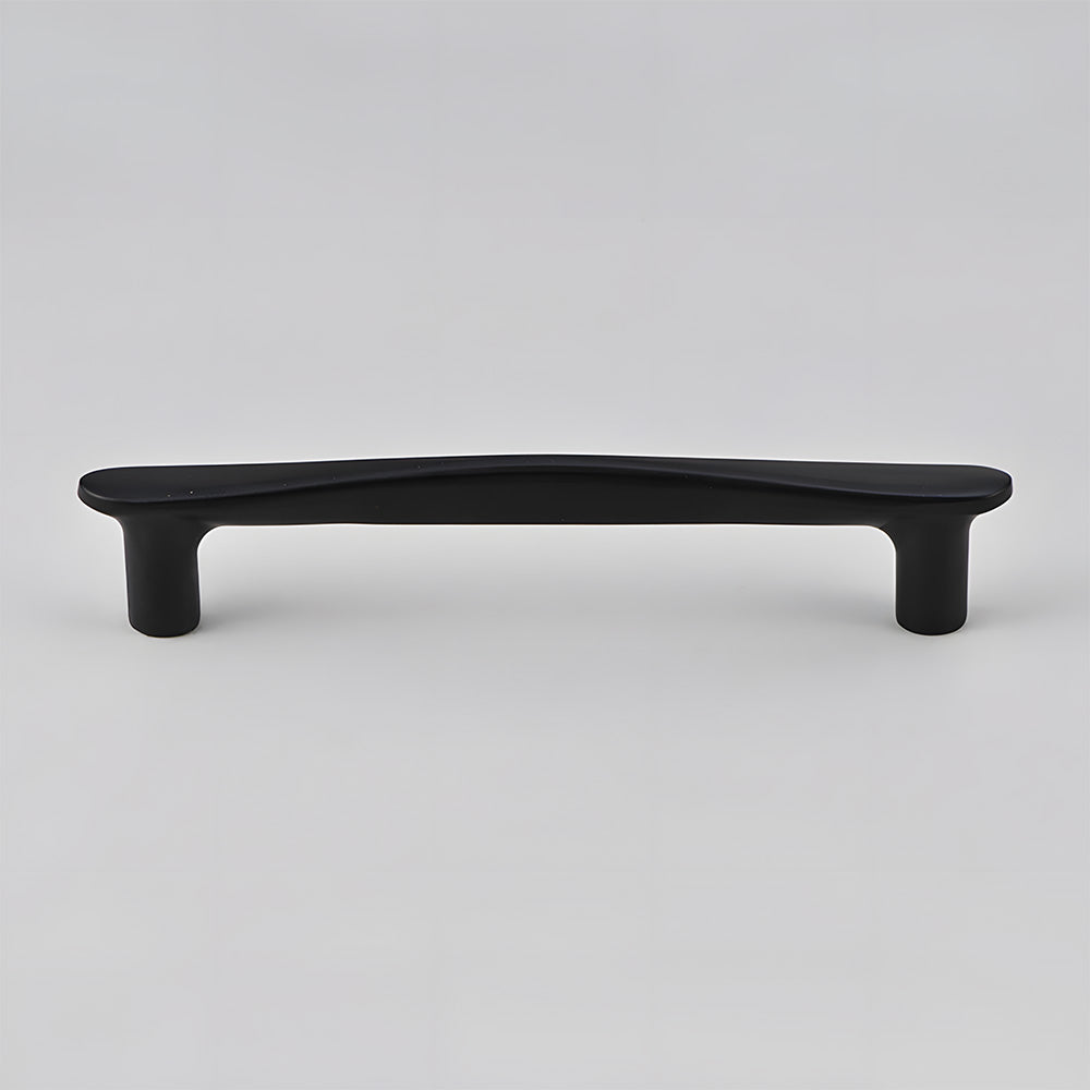 Tapered arched brass cabinet pull, displayed from the side on a clean neutral background