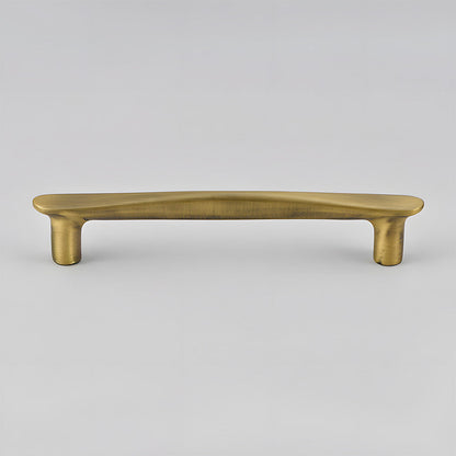 Bronze tapered arched brass cabinet pull, presented in another view on a clean neutral background