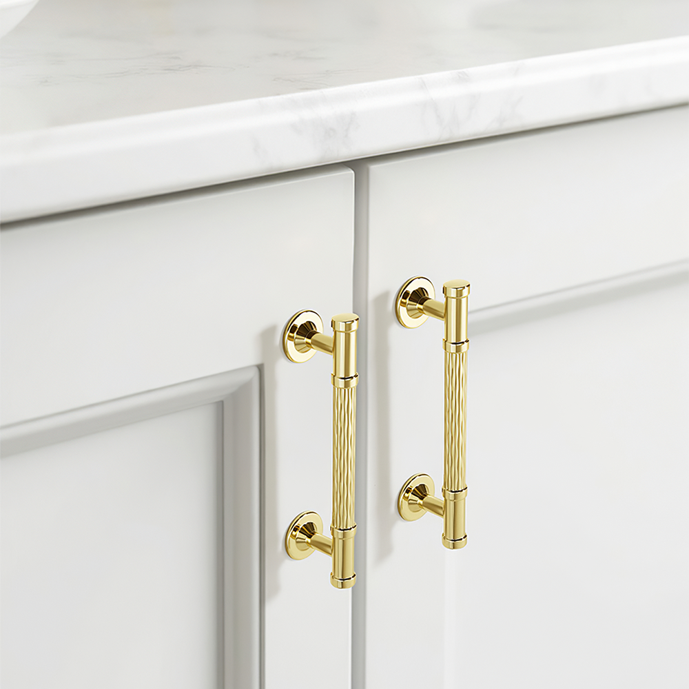 Textured round bar cabinet pull and knob, shown from one angle in an installed cabinet close-up