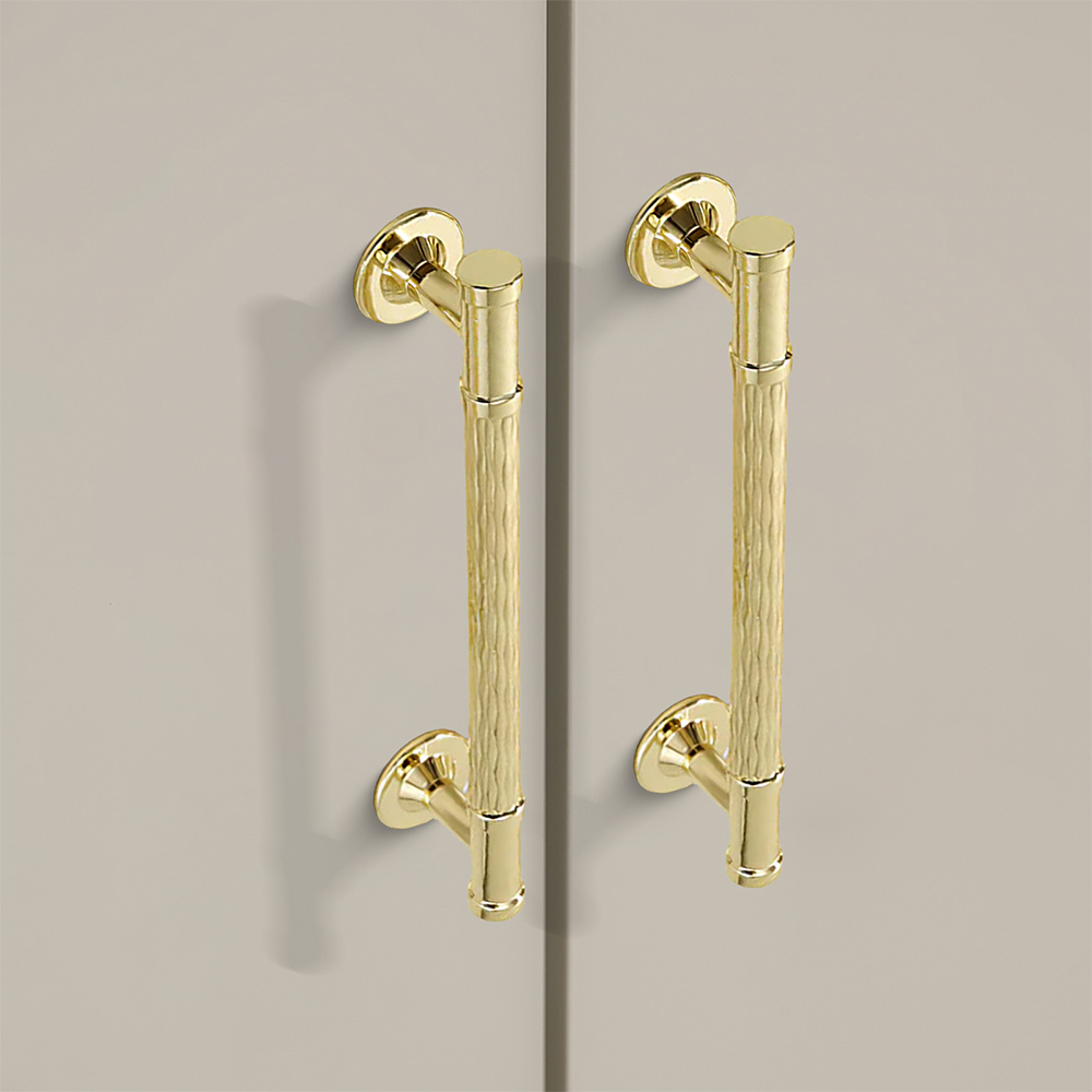Textured round bar cabinet pull and knob, pictured in one view in an installed cabinet close-up