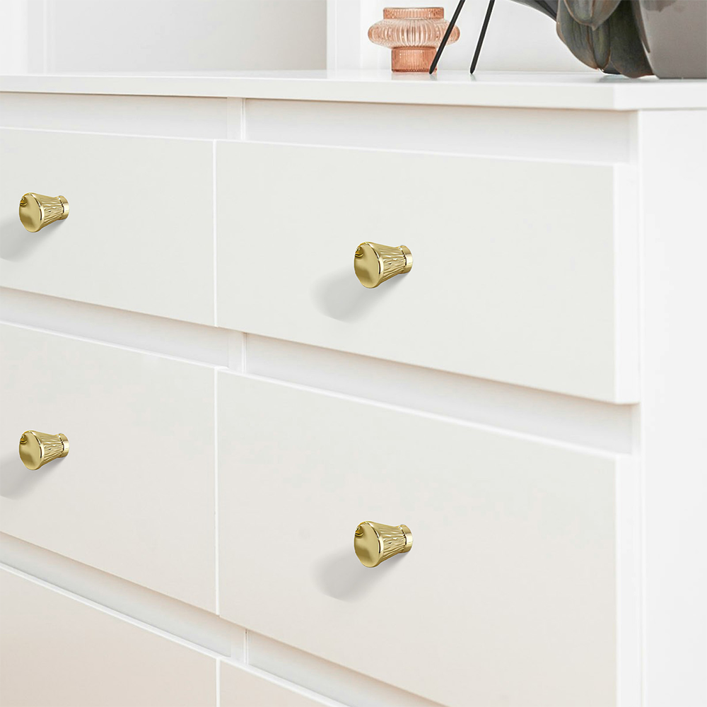 Textured round bar cabinet pull and knob, shown at close range installed on cabinetry in context