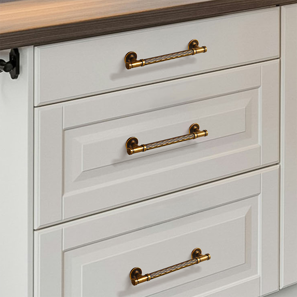 Textured round bar cabinet pull and knob, displayed from the side installed on cabinetry in context