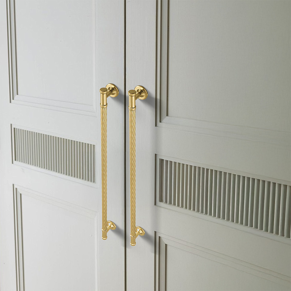 Textured round bar cabinet pull and knob, presented for reference in an installed cabinet close-up