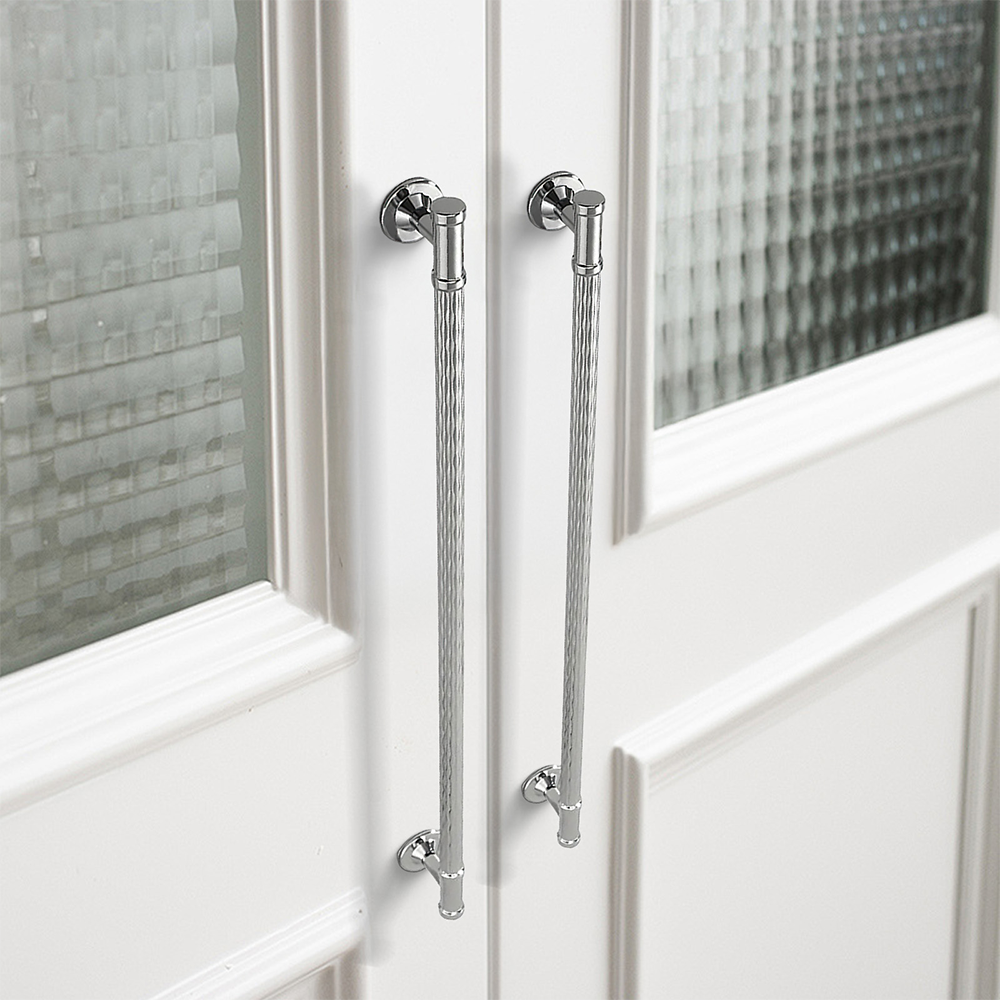 Textured round bar cabinet pull and knob, shown clearly in an installed cabinet close-up