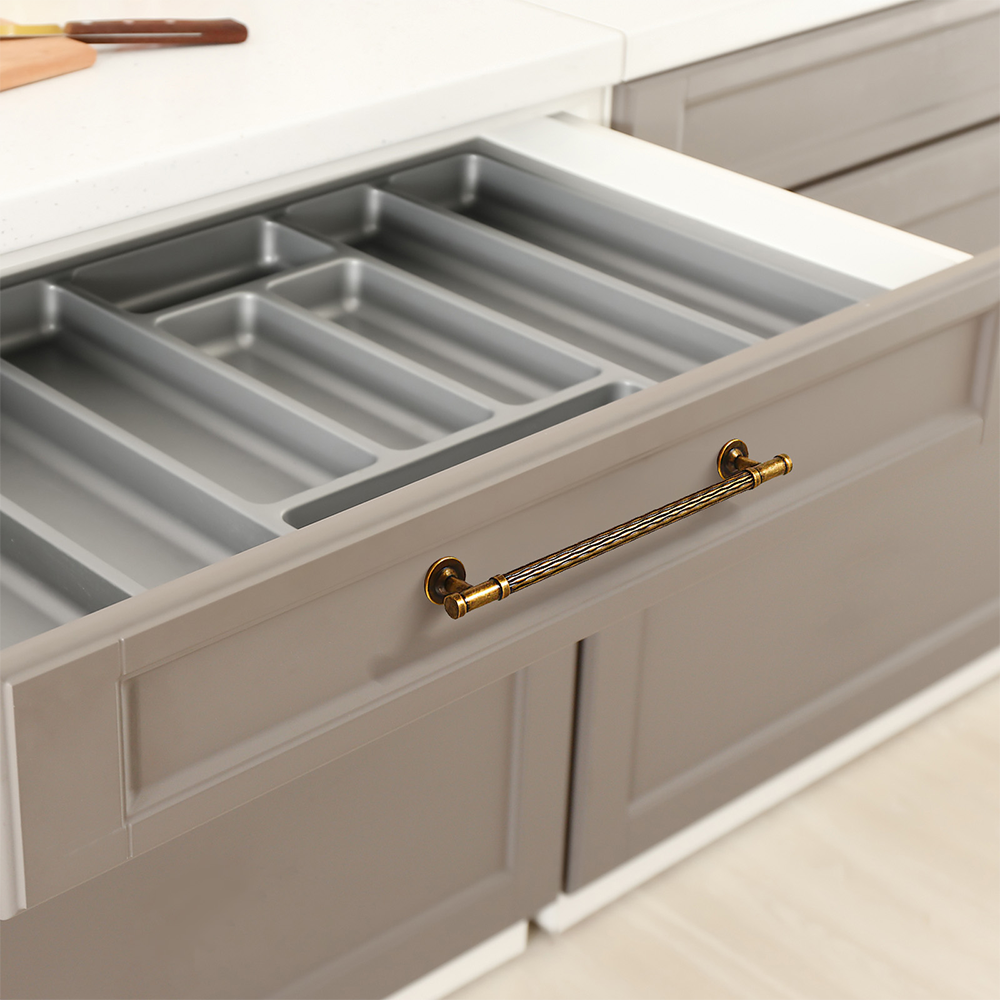 Textured round bar cabinet pull and knob, presented in another view installed on cabinetry in context