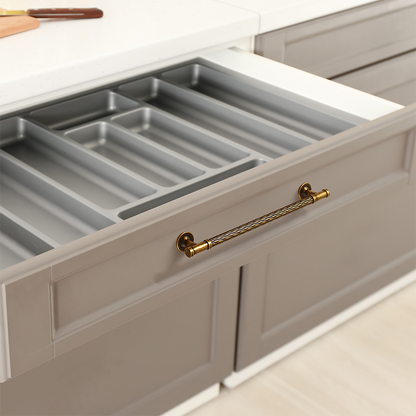 Textured round bar cabinet pull and knob, presented in another view installed on cabinetry in context