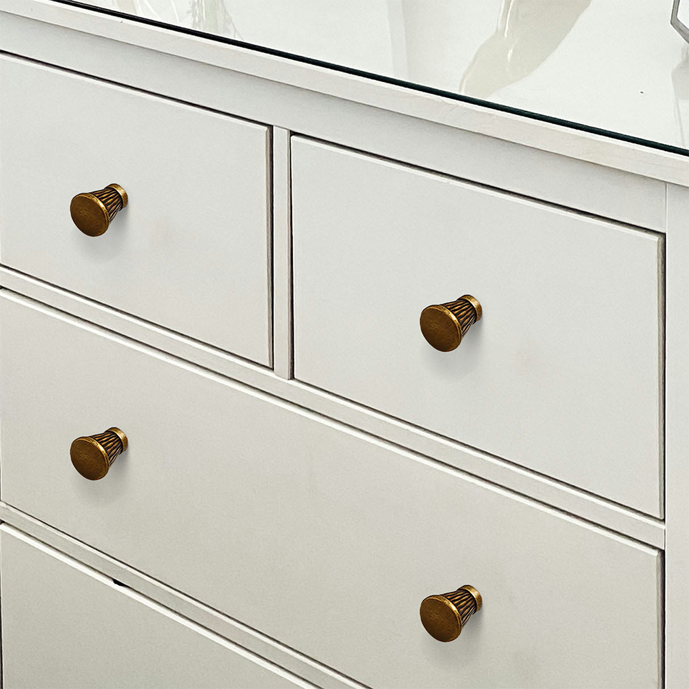 Textured round bar cabinet pull and knob, shown clearly mounted on a finished cabinet front