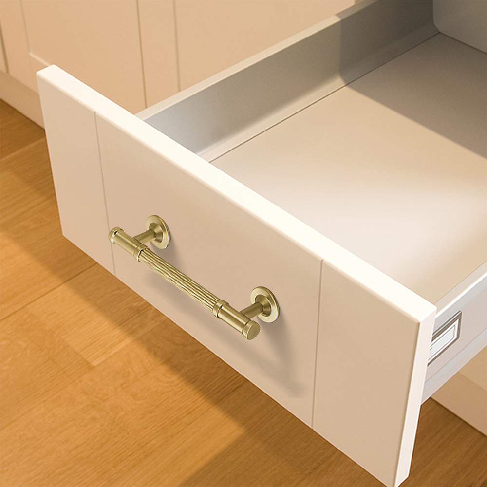 Textured round bar cabinet pull and knob, shown from one angle mounted on a finished cabinet front