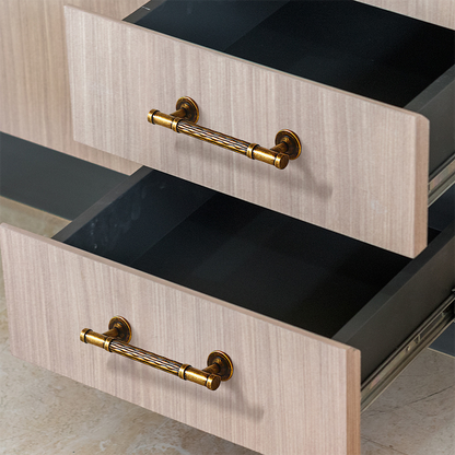 Textured round bar cabinet pull and knob, shown at close range mounted on a finished cabinet front