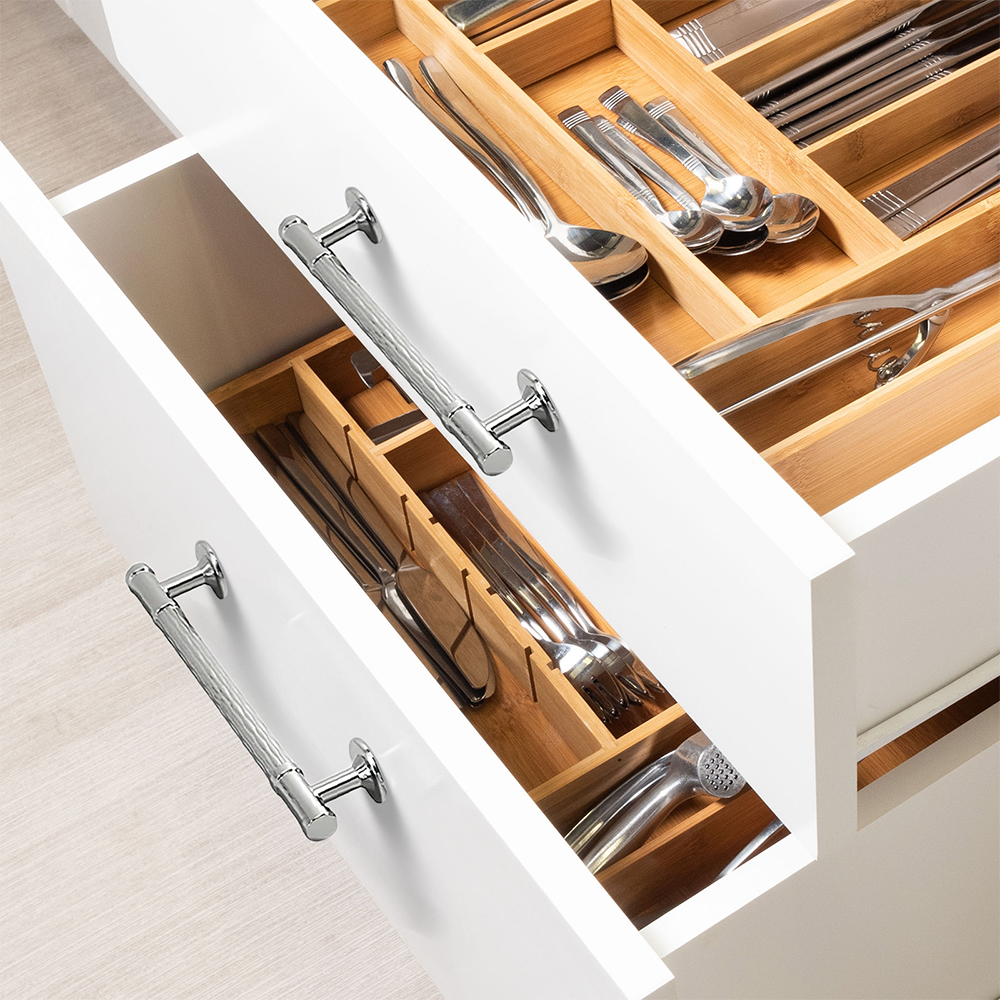 Textured round bar cabinet pull and knob, shown in a focused view mounted on a finished cabinet front
