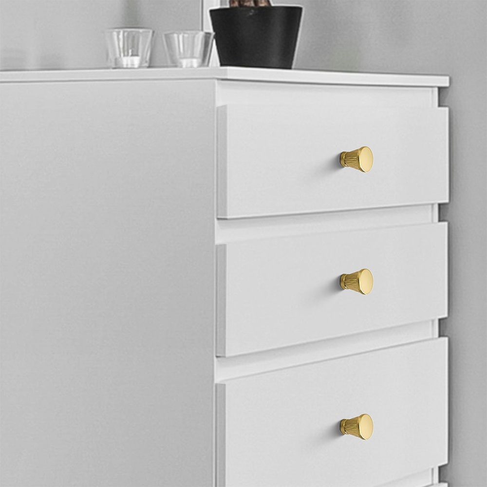 Textured round bar cabinet pull and knob, shown from one angle installed on cabinetry in context