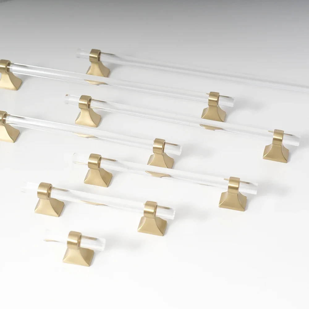 Transparent acrylic bar pull with flared metal mounts, presented for reference as a color and finish lineup