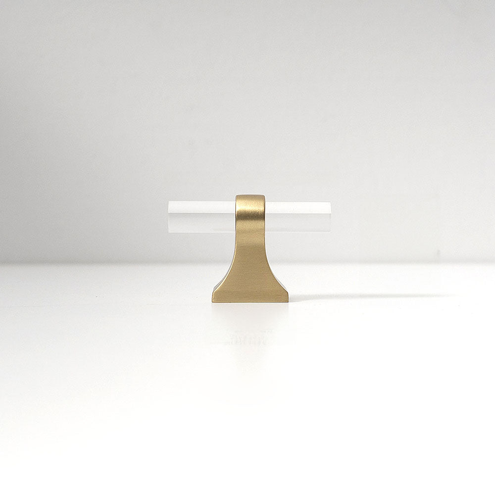 Transparent acrylic bar pull with flared metal mounts, shown in a focused view on a clean neutral background