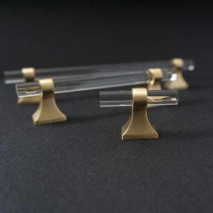 Transparent acrylic bar pull with flared metal mounts, shown clearly with its construction and finish visible