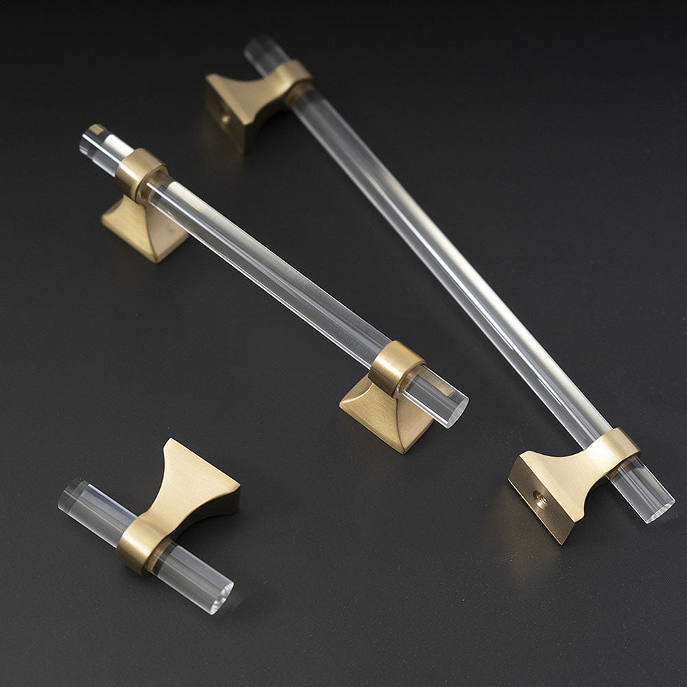 Transparent acrylic bar pull with flared metal mounts, shown from one angle as a color and finish lineup