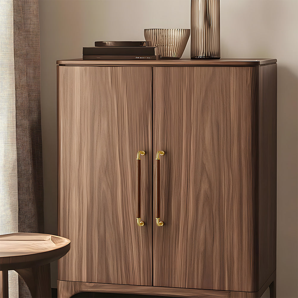 Two-tone wood and metal cabinet pull, pictured in one view installed on cabinetry in context