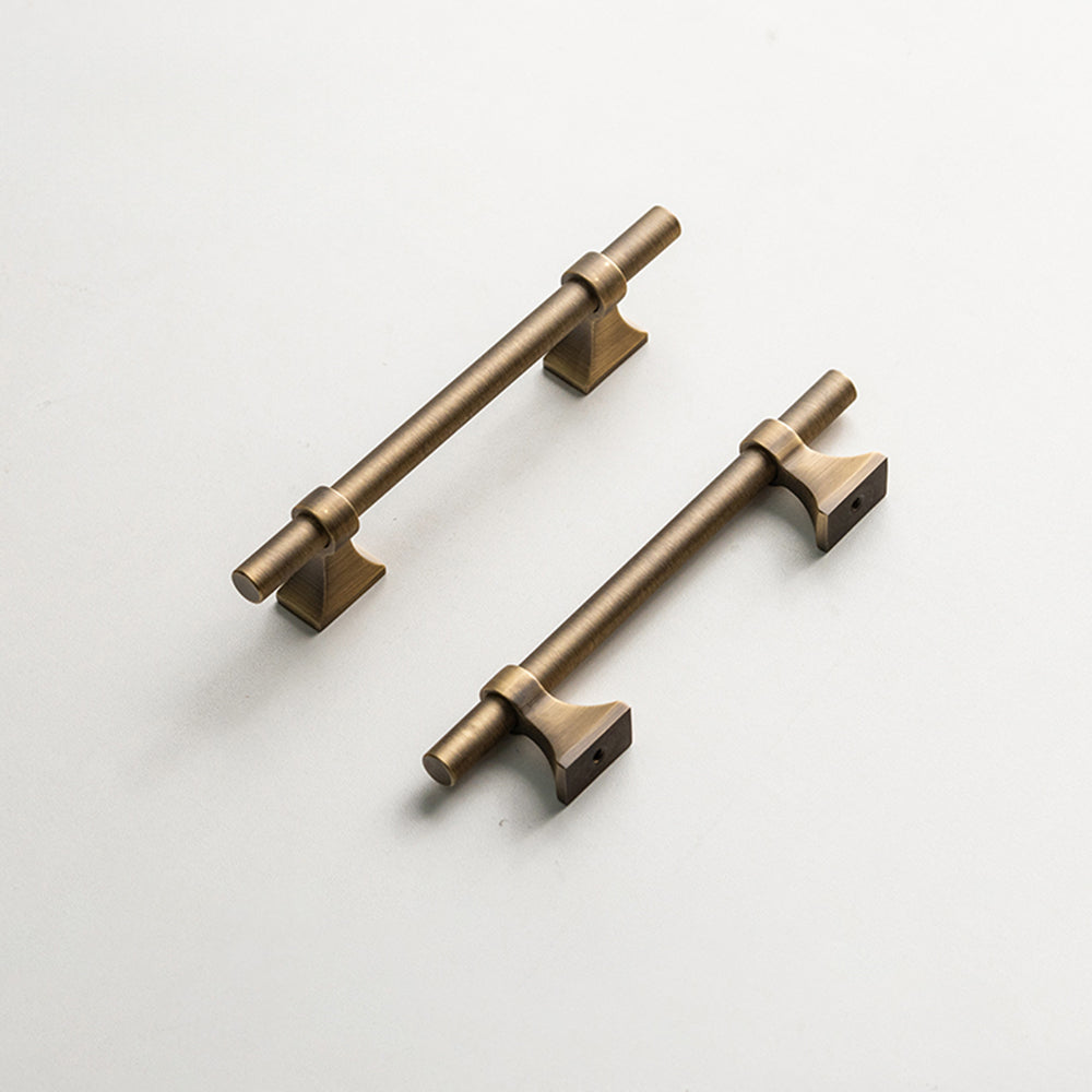 Vintage round bar cabinet pull with pedestal mounts, shown from one angle with related hardware in one display