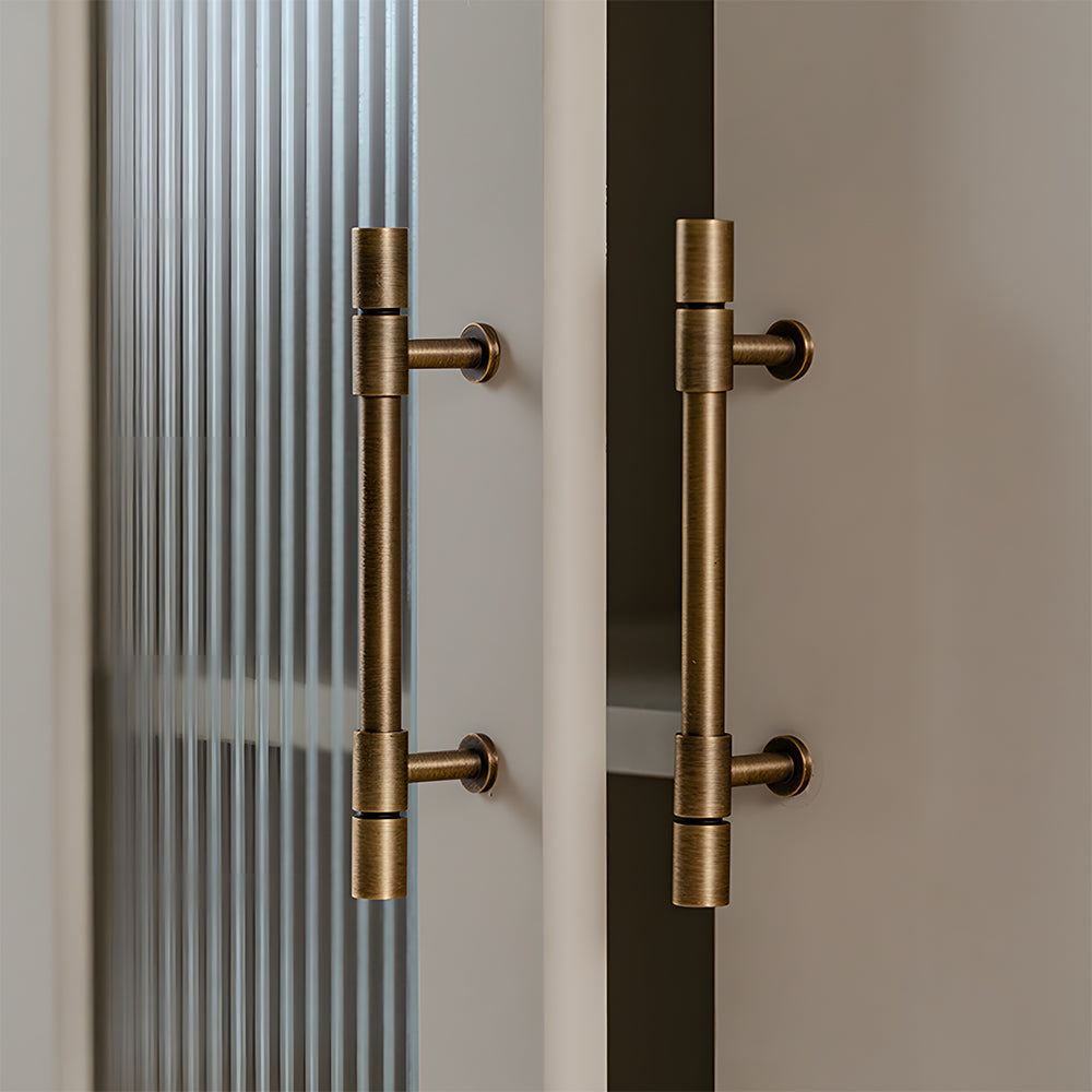Vintage bronze brass T-bar cabinet pull, presented in another view installed on cabinetry in context