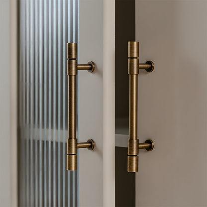 Vintage bronze brass T-bar cabinet pull, presented in another view installed on cabinetry in context