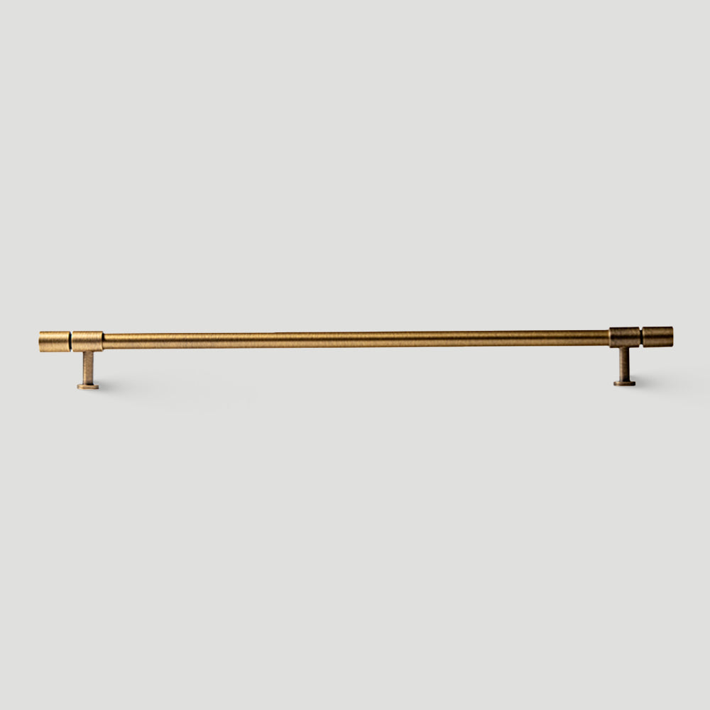 Vintage bronze brass T-bar cabinet pull, shown at close range on a clean neutral background