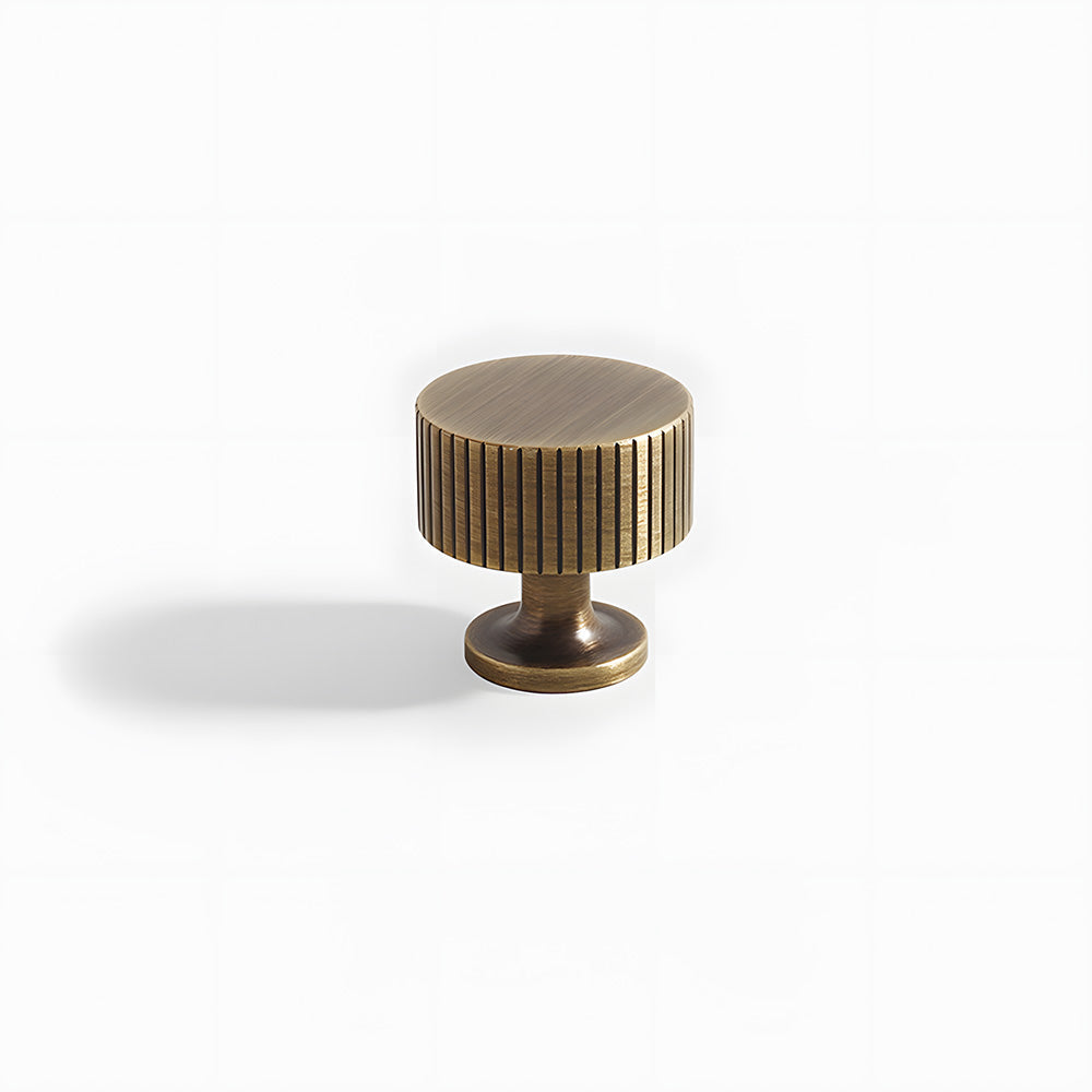 Lined aged-bronze brass T-bar cabinet pull and knob, presented for reference on a clean neutral background