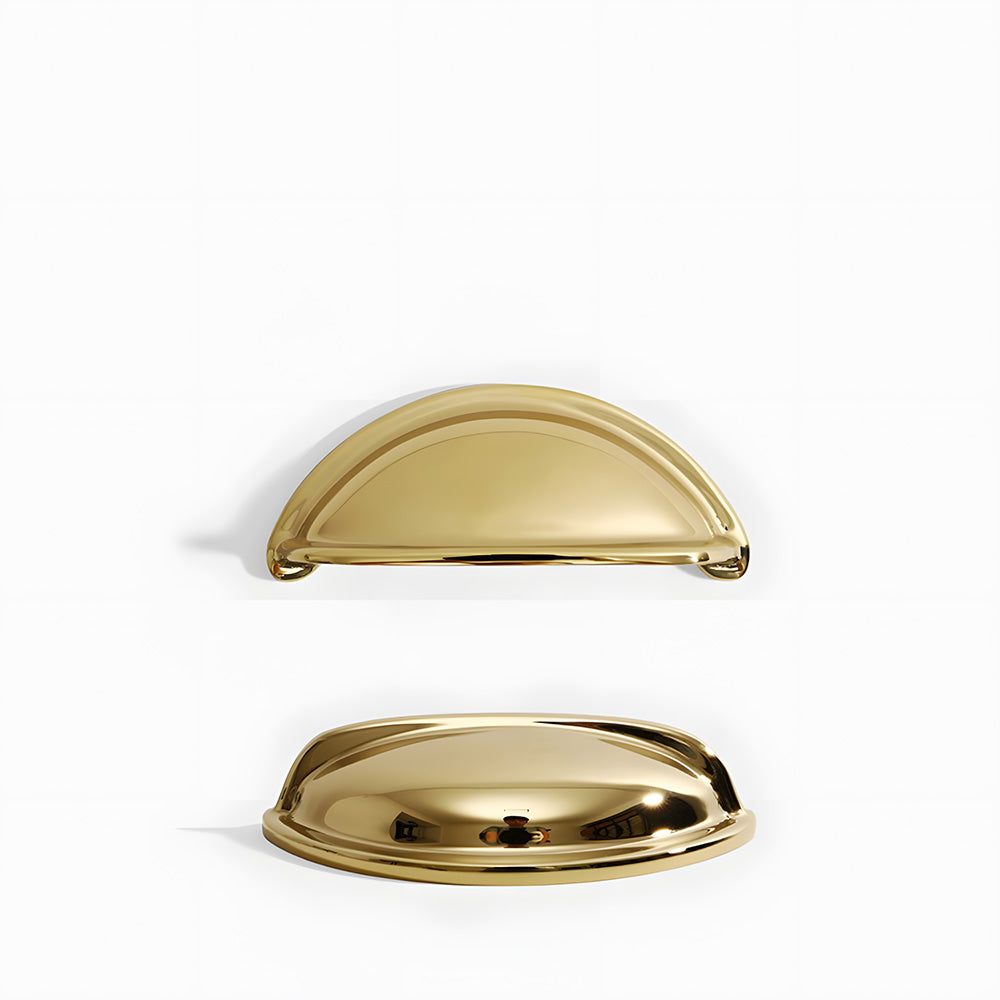 Vintage shell brass cup pull and round knob, displayed from the side on a clean neutral background