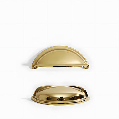 Vintage shell brass cup pull and round knob, displayed from the side on a clean neutral background