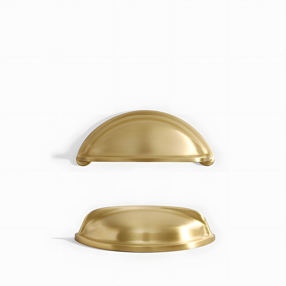 Vintage shell brass cup pull and round knob, presented for reference on a clean neutral background