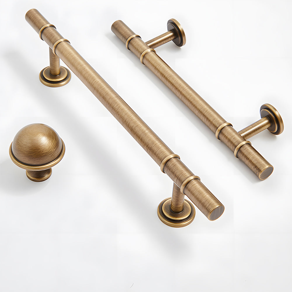 Vintage brass T-bar cabinet pull and round knob, pictured in one view with related hardware in one display