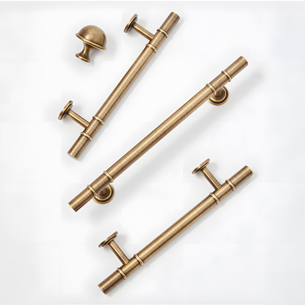 Vintage brass T-bar cabinet pull and round knob, presented for reference with related hardware in one display