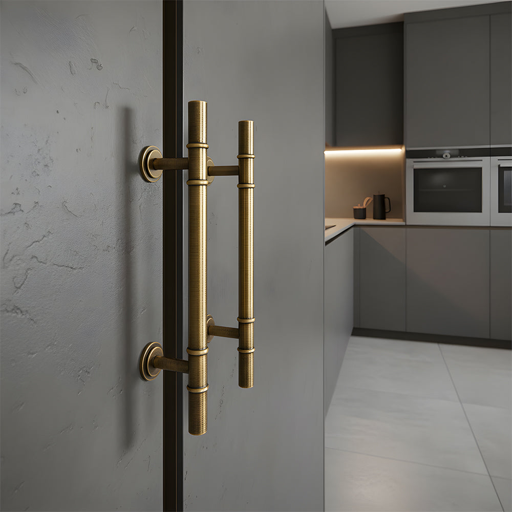 Vintage brass T-bar cabinet pull and round knob, pictured in one view installed on cabinetry in context