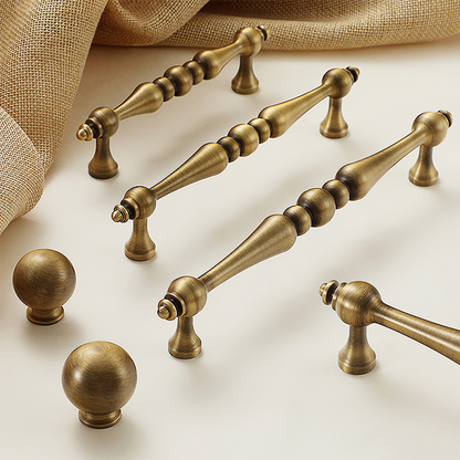 Bronze vintage turned brass cabinet pull and round knob, shown in a focused view as a color and finish lineup