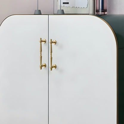 Vintage turned brass cabinet pull and round knob, shown in a focused view installed on cabinetry in context