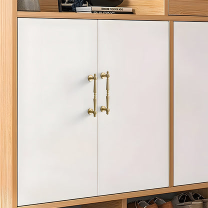 Vintage turned brass cabinet pull and round knob, presented in another view installed on cabinetry in context
