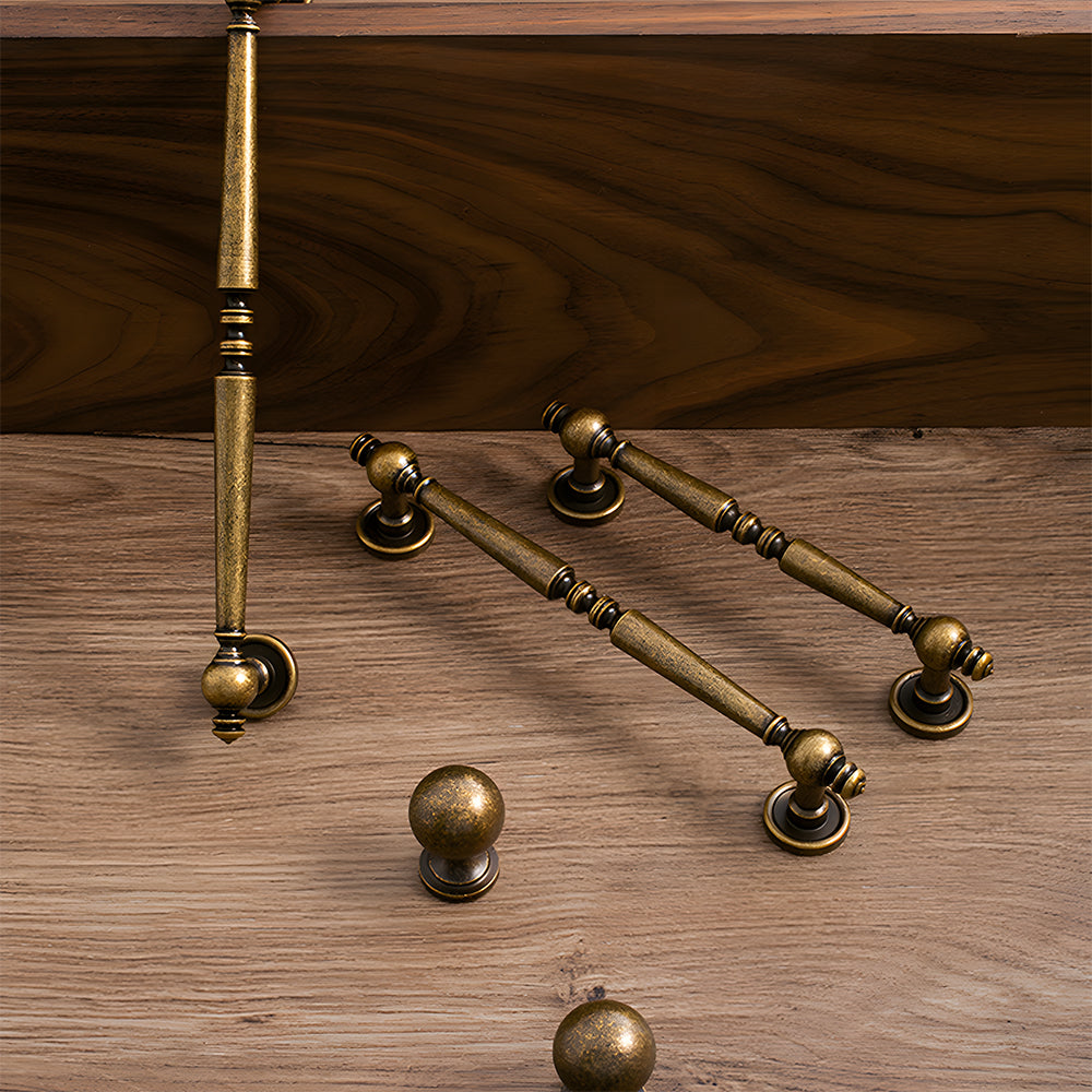 Vintage turned brass cabinet pull and round knob, pictured in one view as a color and finish lineup