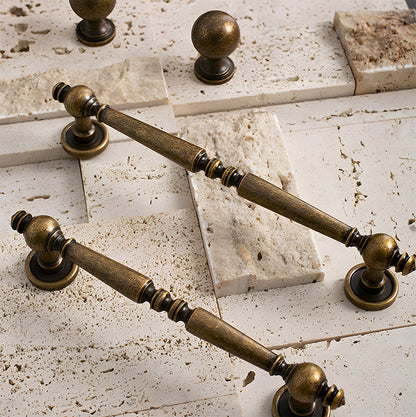 Vintage turned brass cabinet pull and round knob, presented for reference as a color and finish lineup