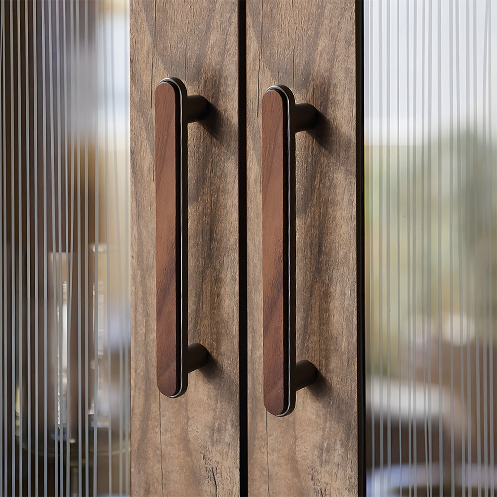 Walnut inlay cabinet pull in gray with 128 mm centers, mounted as matching hardware on double cabinet doors