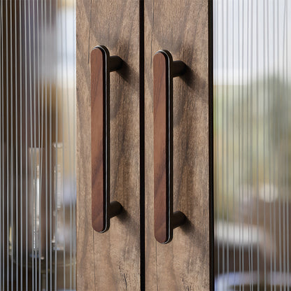 Walnut inlay cabinet pull in gray with 128 mm centers, mounted as matching hardware on double cabinet doors