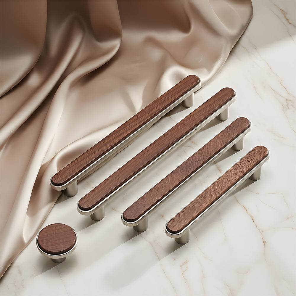 Walnut wood inlay cabinet pull with a silver-toned frame, grouped on a light surface to compare lengths and profiles